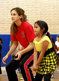 PVHS Girls' Volleyball player coaching Boys & Girls Club member